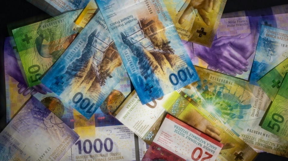 Swiss central bank holds interest rates, with eye on currency risks