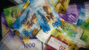 Swiss central bank holds interest rates, with eye on currency risks