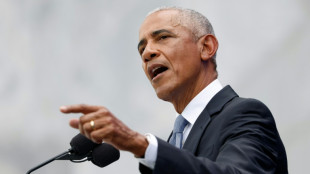 Ex-presidents and stars, but no Trump, turn out for Obama Library