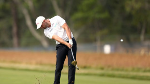Clark stumbles but still leads by two at US Open
