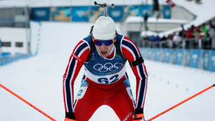 Olympic bronze medal biathlete confesses affair on live TV