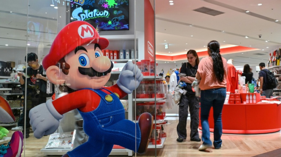 Asian stocks extend gains but US concerns hit dollar, boost gold