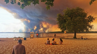 Over 100,000 flee or hole up indoors as wildfires rage in France and Spain