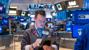Rotation de placements &agrave; Wall Street qui termine mitig&eacute;e apr&egrave;s l'inflation am&eacute;ricaine