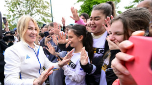 50 years after Olympic glory, Comaneci's homecoming sparks hope of new path to perfection