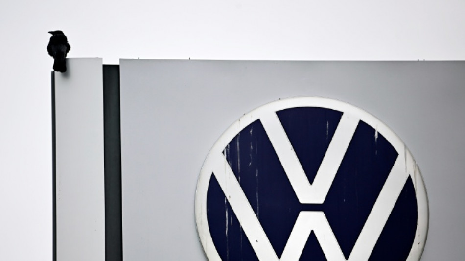 Volkswagen profit plunges as carmaker weighs mass job cuts