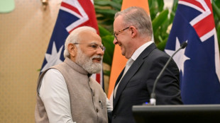 Modi visits Australia for minerals talks and rockstar welcome