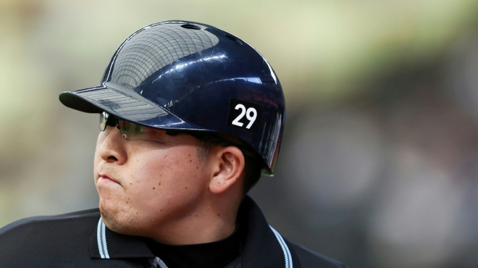 Japan baseball umpires wear 29 in tribute to unconscious colleague