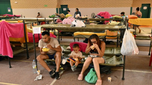 With minutes to flee, Spain fire evacuees grab what they can