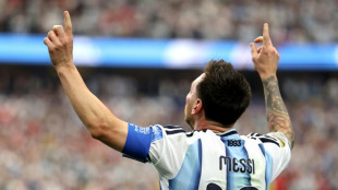 Magic Messi makes World Cup history to send Argentina into last 32