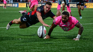 Lyon edge Stade Francais in wild try-fest to stay top in France