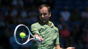 Three-time finalist Medvedev grinds into Australian Open round two