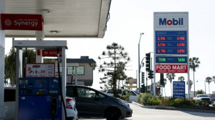 US revises first quarter growth down while inflation climbs