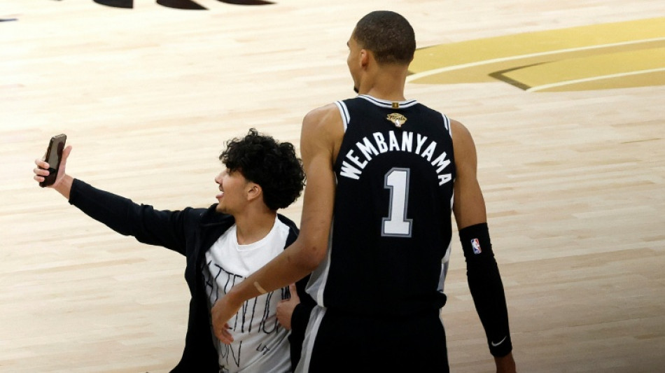 Selfie-seeking fan banned for life by NBA after crashing Finals game
