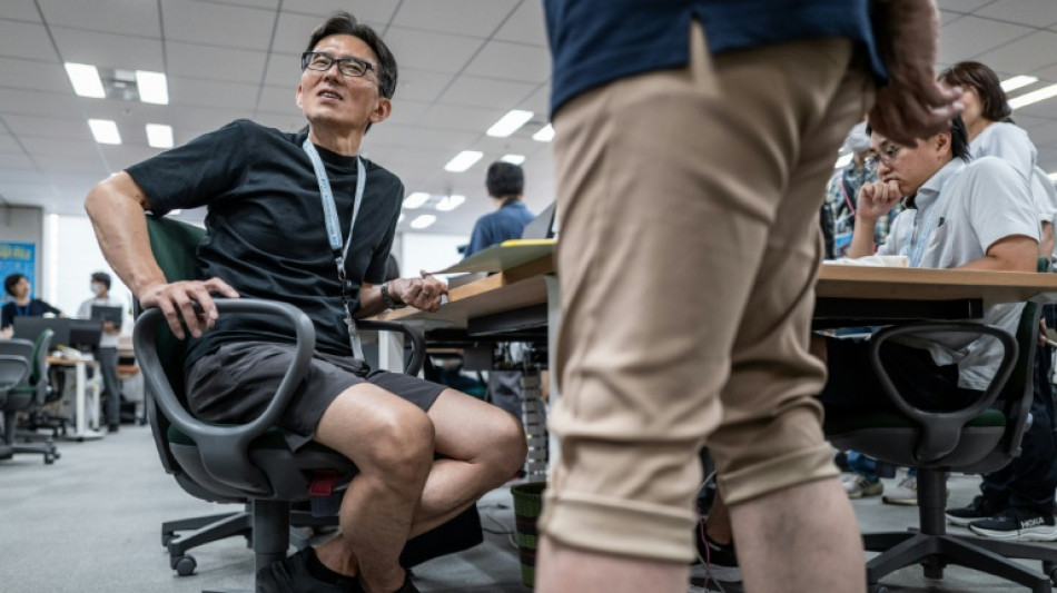 Too hot: Buttoned-up Tokyo officials ditch suits for 'cool' shorts