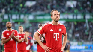 Kane penalty miss as Olise rescues Bayern to pile pressure on Wolfsburg
