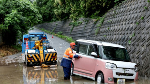 Four injured, flights cancelled in Japan as twin storms approach